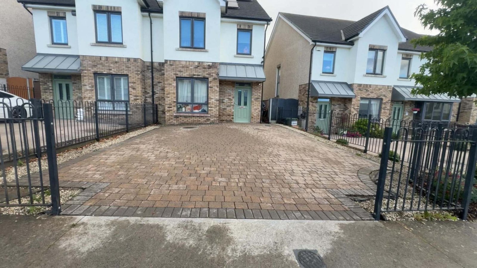 Same estate driveway power washed back to clean, bright block paving